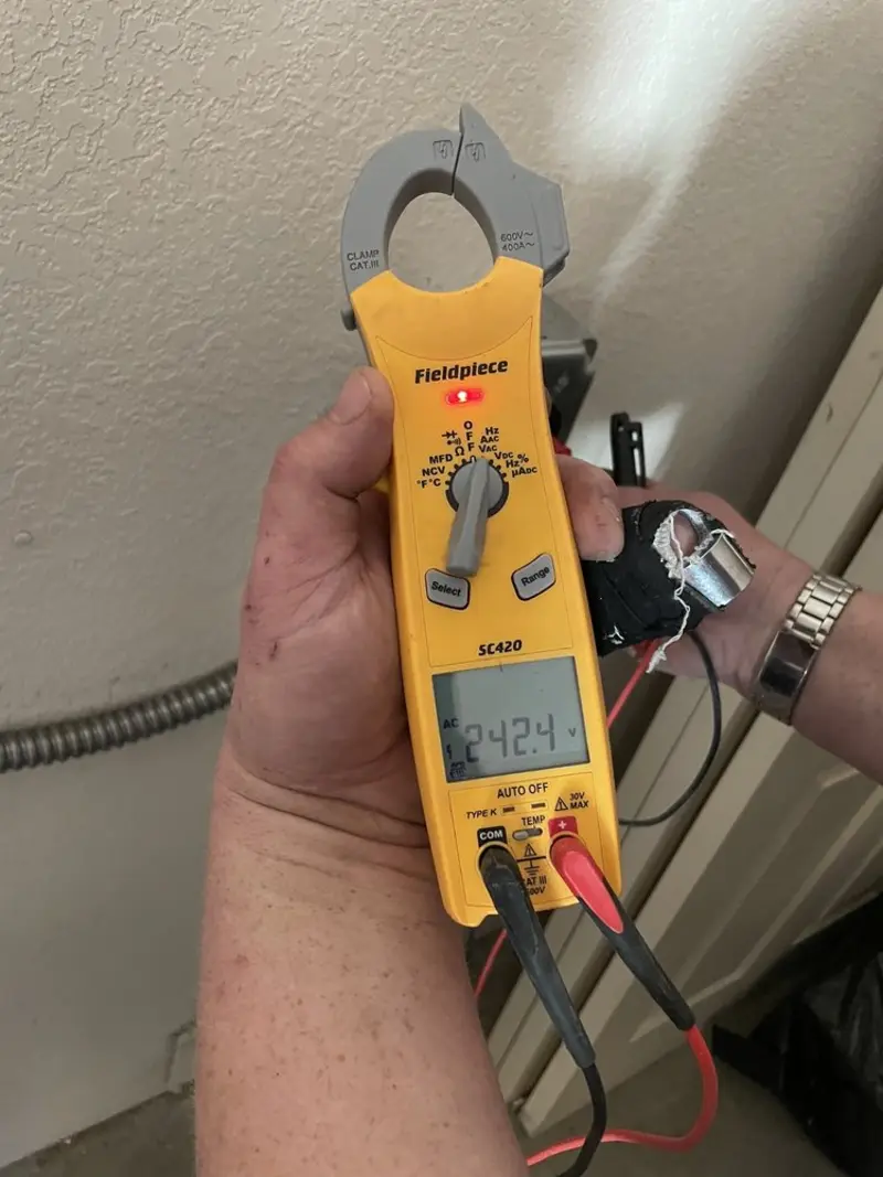 Voltage testing with clamp meter during Outlet Installation in Robinson